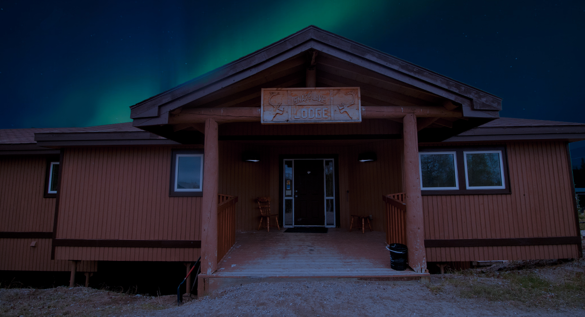 Snare Lake Lodge with Northern Lights at top 